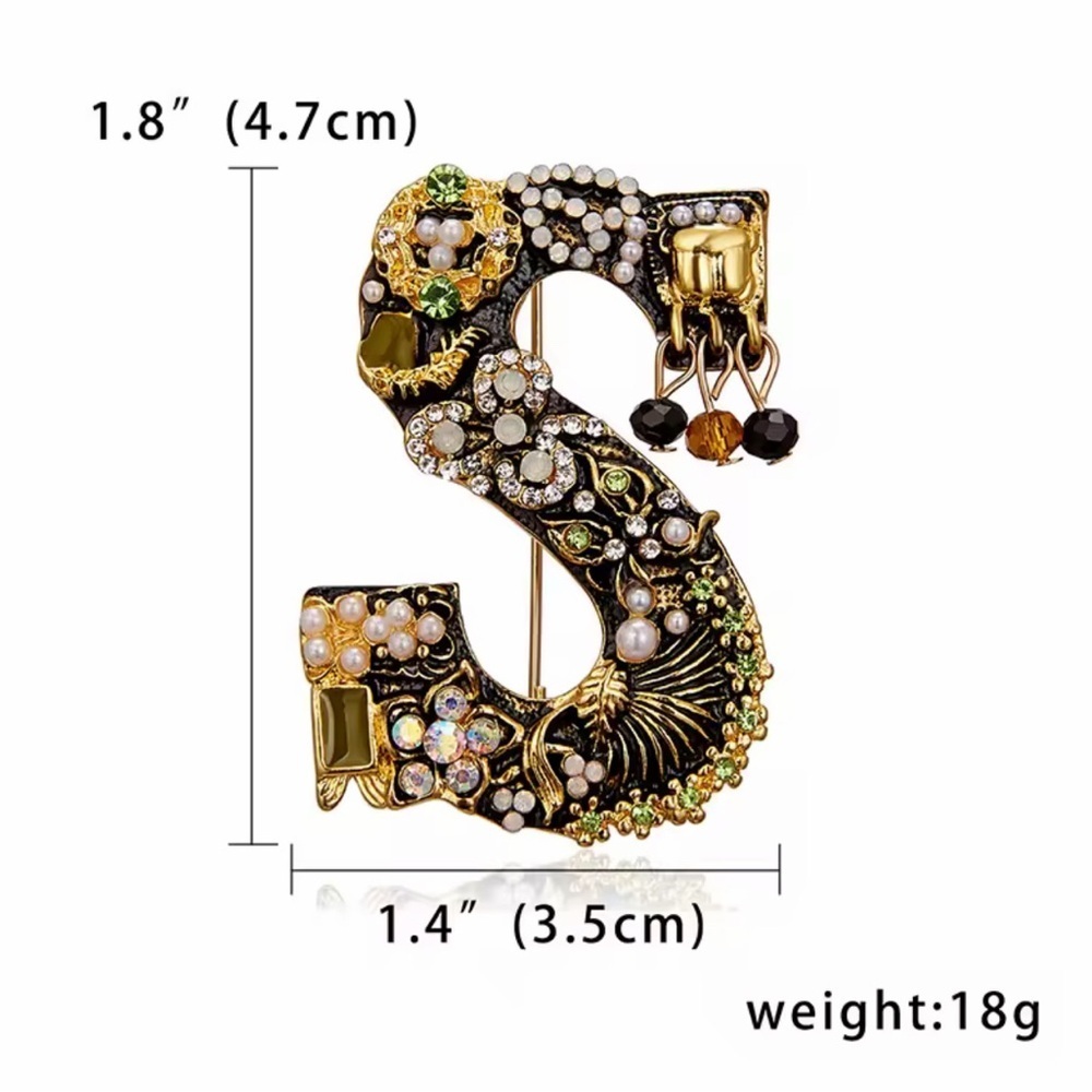 Elegant Gold and Black Brooch with Crystal Accents - Picture 6 of 6